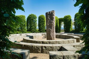 A stone monument surrounded by a circular stone pathway.