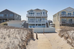 Enjoy stunning beach views from the upper-level balcony of this coastal property.