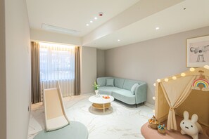 Family Aqua Suite Twin | Living area | 65-inch Smart TV with digital channels, TV, Netflix