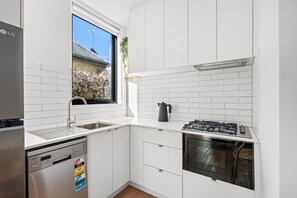 Studio | Private kitchen | Full-size fridge, microwave, oven, stovetop - Peppertree Apartments (Sale)