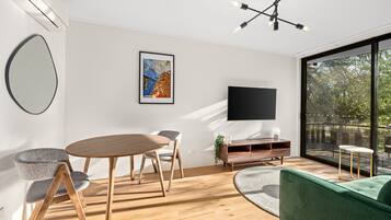 Apartment | Living area | 55-inch Smart TV with digital channels, TV, Netflix