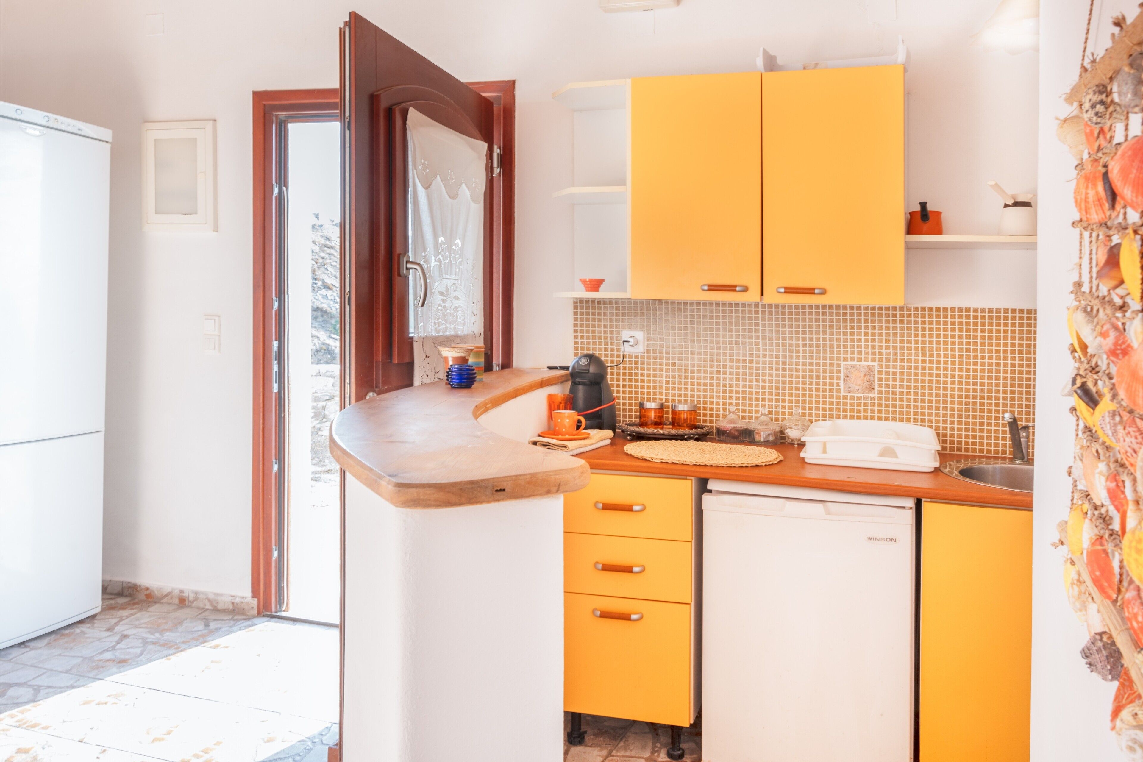 Fridge, stovetop, coffee/tea maker, toaster