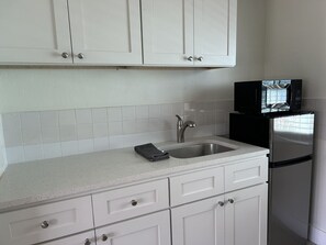 Microwave, coffee/tea maker, toaster, paper towels