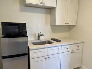 Microwave, coffee/tea maker, toaster, dining tables