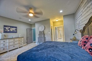 A bedroom with a bed, dresser, and a ceiling fan. - Coastal Club * 18353 * NEW Exceptional Lewes Beach House (Lewes)