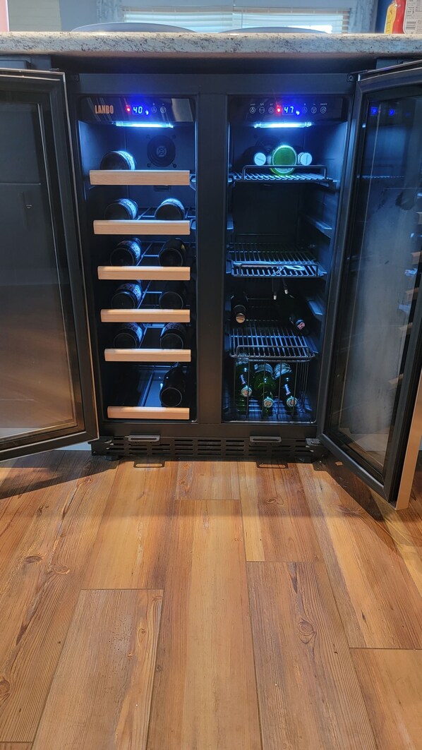 A wine refrigerator with multiple shelves, a digital display, and a control panel. - 10 Florida Ave 200Ft to Water Pet Friendly Broadkill Beach Home Bay Block (Milton)