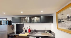 Enjoy cooking in this well-equipped kitchen with a refrigerator, oven, and dishwasher.