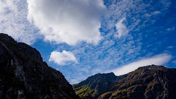 A mountainous landscape with rugged terrain and a clear sky.