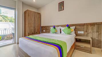 Desk, iron/ironing board, bed sheets