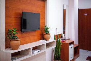 Mountain View Junior Suite | Living area | 32-inch flat-screen TV with cable channels