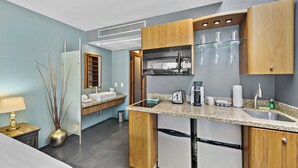 A modern kitchen with wooden cabinets, a granite countertop, and stainless steel appliances.