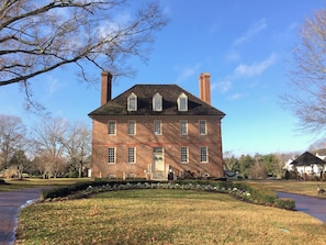 A large brick building with multiple windows and a central entrance. - Historic Powhatan Resort - Spacious 2BR Condo Near Colonial Williamsburg (Williamsburg)