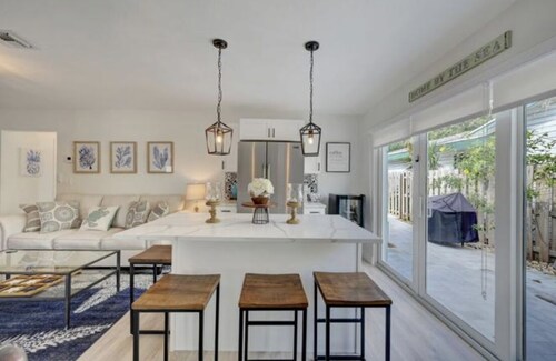 Less than a Mile to the beach! Walk to shops and beach! Villa pool house dream! 