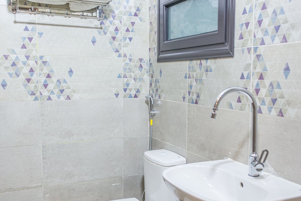 Shower, rainfall showerhead, bidet, towels