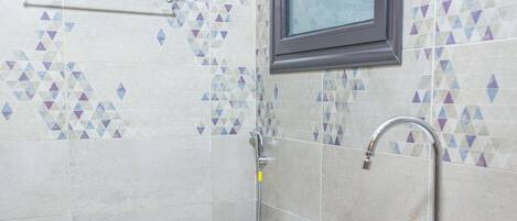 Shower, rainfall showerhead, bidet, towels