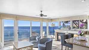 A spacious balcony with a view of the ocean, furnished with a table, chairs, and a sofa. - 3 Unobstructed ocean view direct beach access! Oceanfront Villa with a Spectacular View (C) (Laguna Beach)