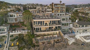 A multi-story coastal property with balconies, a pool, and a view of the beach. - 6 Ocean views, direct beach access Sunset Cove Laguna BCH (F) (Laguna Beach)
