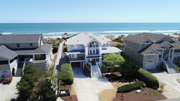 A coastal residential area with houses featuring balconies and a view of the ocean. - Ocean Views, Den, Community Pools, Close to Beach access, 103, Brigadune-Oceanfront (Corolla)