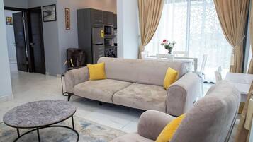 Standard Double Room | Living area | 55-inch Smart TV with satellite channels