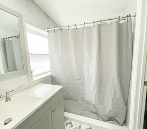 Shower, hair dryer, slippers, soap