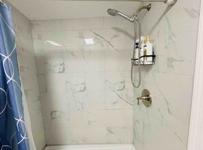 Shower, hair dryer, slippers, soap