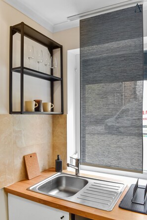 Comfort Suite | Private kitchen | Full-size fridge, microwave, oven, coffee/tea maker