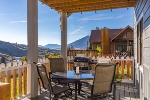 Relax on the patio surrounded by rolling hills and a scenic view.