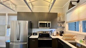 A modern kitchen with stainless steel appliances, a microwave, and a built-in oven.