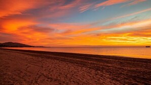 A beach with a sunset.