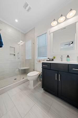 Shower, hair dryer, towels, soap