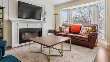 Smart TV, fireplace, books