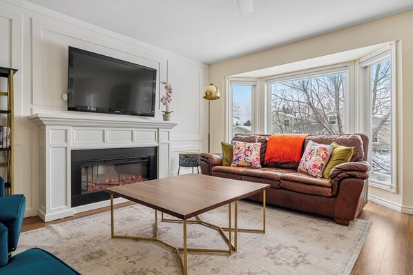 Smart TV, fireplace, books