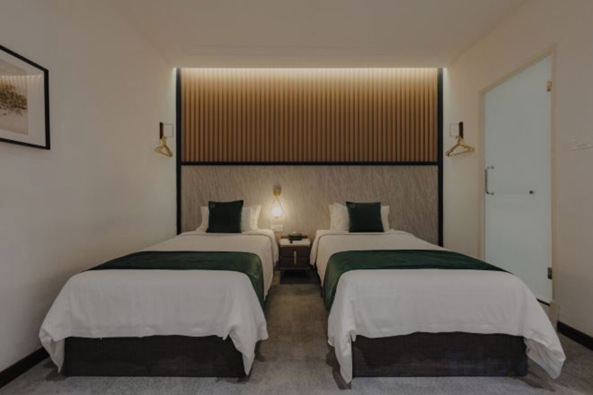 Premium bedding, blackout curtains, iron/ironing board (on request)
