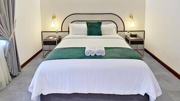 Quarto standard | Roupas de cama premium, cortinas blackout, ferros/tábuas de passar roupa