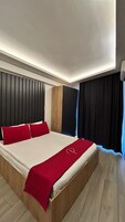 Quarto casal luxo | Roupas de cama premium, frigobar, Wi-Fi de cortesia, roupa de cama