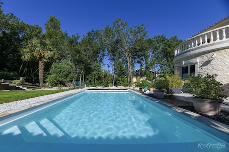 Seasonal outdoor pool, open 9:30 AM to 8:00 PM, pool umbrellas