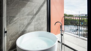 A bathroom with a large, round, white sink and a modern faucet. - REF Okinawa Arena by VESSEL HOTELS (Okinawa)