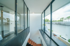 Stylish staircase leads up to a modern space with clean lines and minimalist design.
