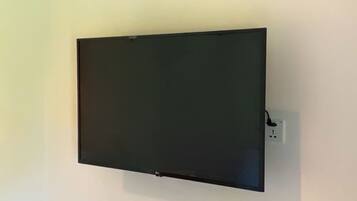 A flat-screen TV mounted on a plain wall.