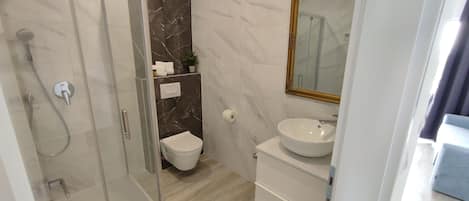 Shower, hair dryer, towels, soap