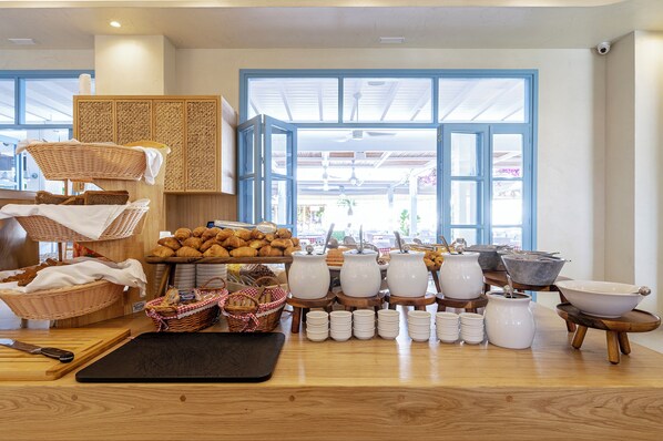 A bakery with various baked goods, kitchenware, and baskets.