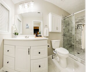 Shower, hair dryer, towels, soap