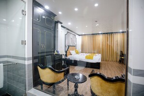 Deluxe Room, 1 King Bed, City View | Bathroom | Shower, hydromassage showerhead, designer toiletries, hair dryer
