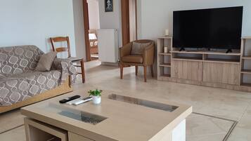 Panoramic Cottage, 3 Bedrooms, Sea View | Living area | 50-inch Smart TV with cable channels, TV