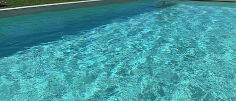 Seasonal outdoor pool, open 10:00 AM to 8:00 PM, pool umbrellas
