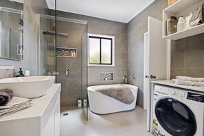 Shower, hair dryer, towels, toilet paper