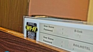 A sign with a free Wi-Fi symbol and placeholders for user names and passwords.