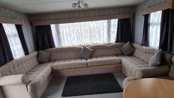 Maison, plusieurs lits | Coin séjour | Cheminée