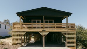 A wooden structure with a balcony and a sign that reads "HAVEN". - The Haven • Outdoor Tub • Backyard Oasis • As seen on Magnolia Network (Kill Devil Hills)