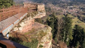A high vantage point with a metal railing overlooking a town and forested hills. - Comfortable rarounette gite in the heart of the Vosges mountains (celles sur plaine)